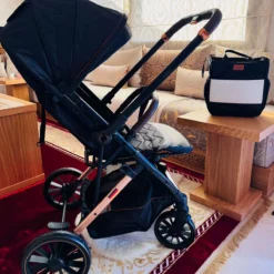 a baby stroller kidilo in a room