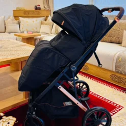 a black stroller in a room