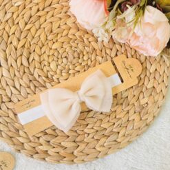 Serre-tête noeud papillon : douceur et féminité